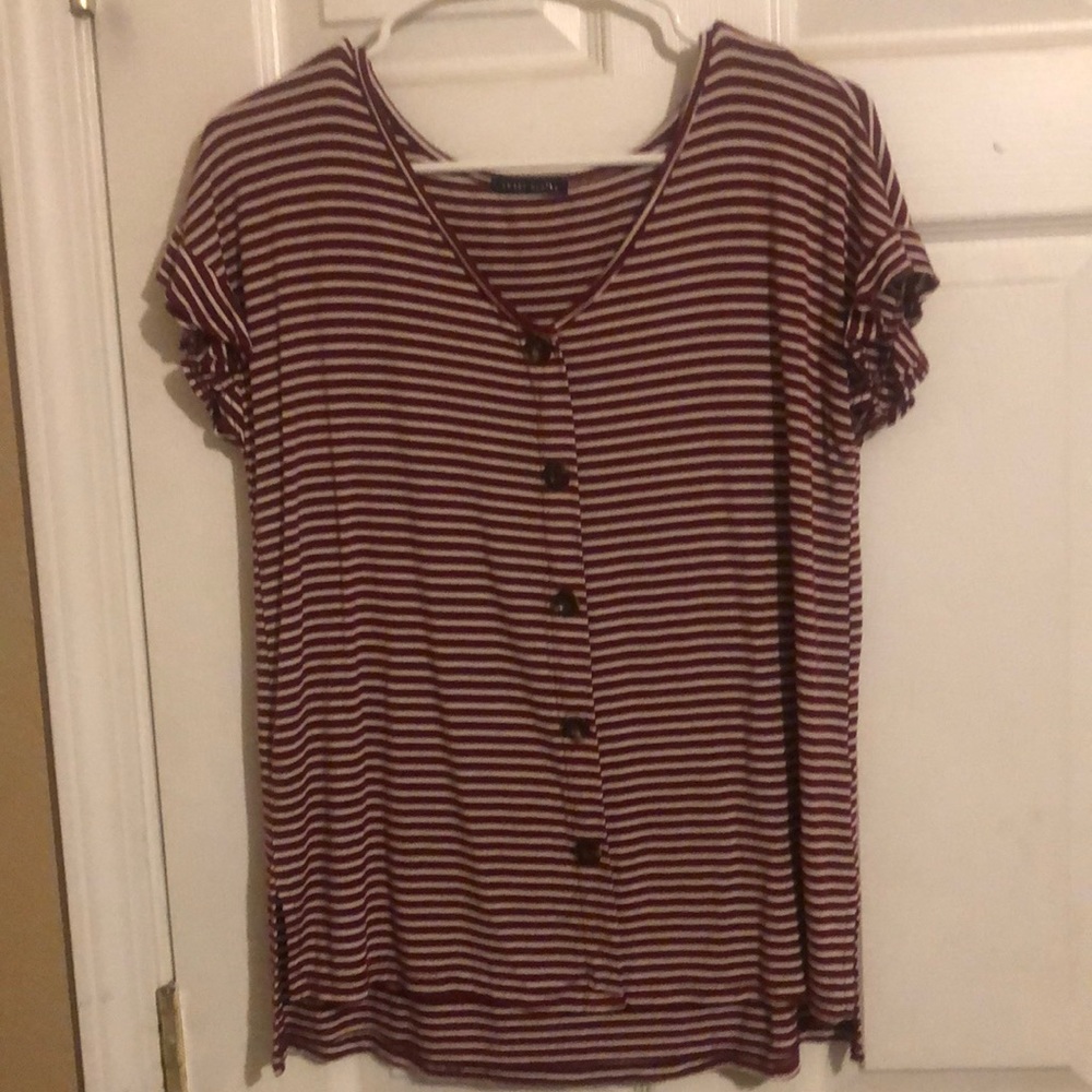 This is a striped blouse from Sweet Claire’s